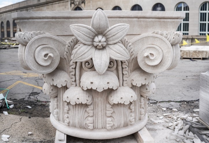 John Goodrow Sr., of Capital Stoneworks Inc., located in Bridgeport, Michigan; spent 428 hours carving the capital stone from a 21,000-pound limestone block