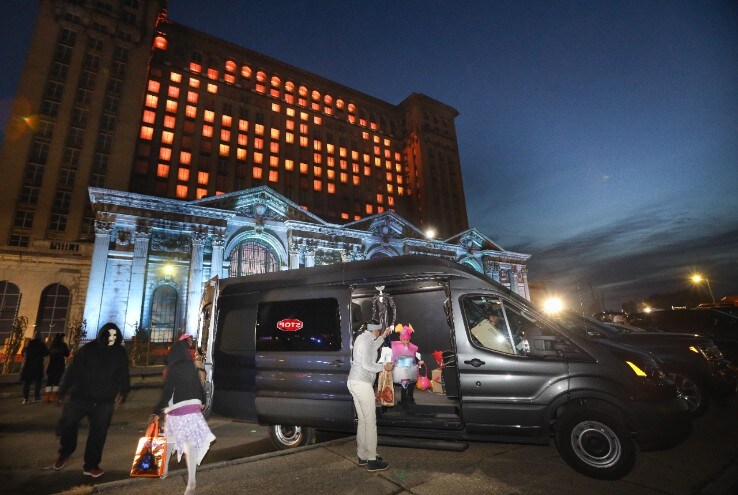 Ford vehicles form a trunk-or-treat parking lot outside the station that is open to the public