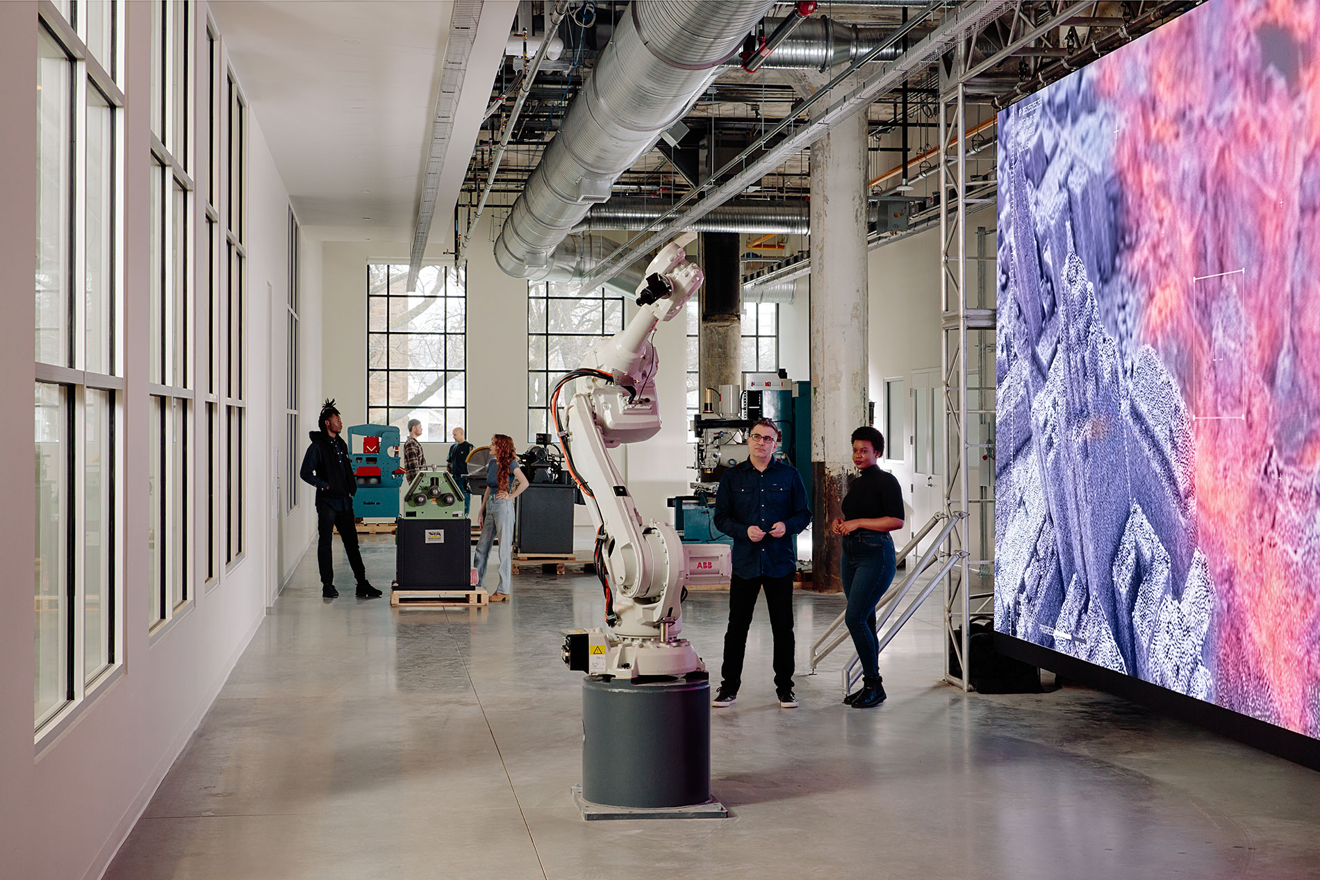 Inspecting a robotic arm at Newlab