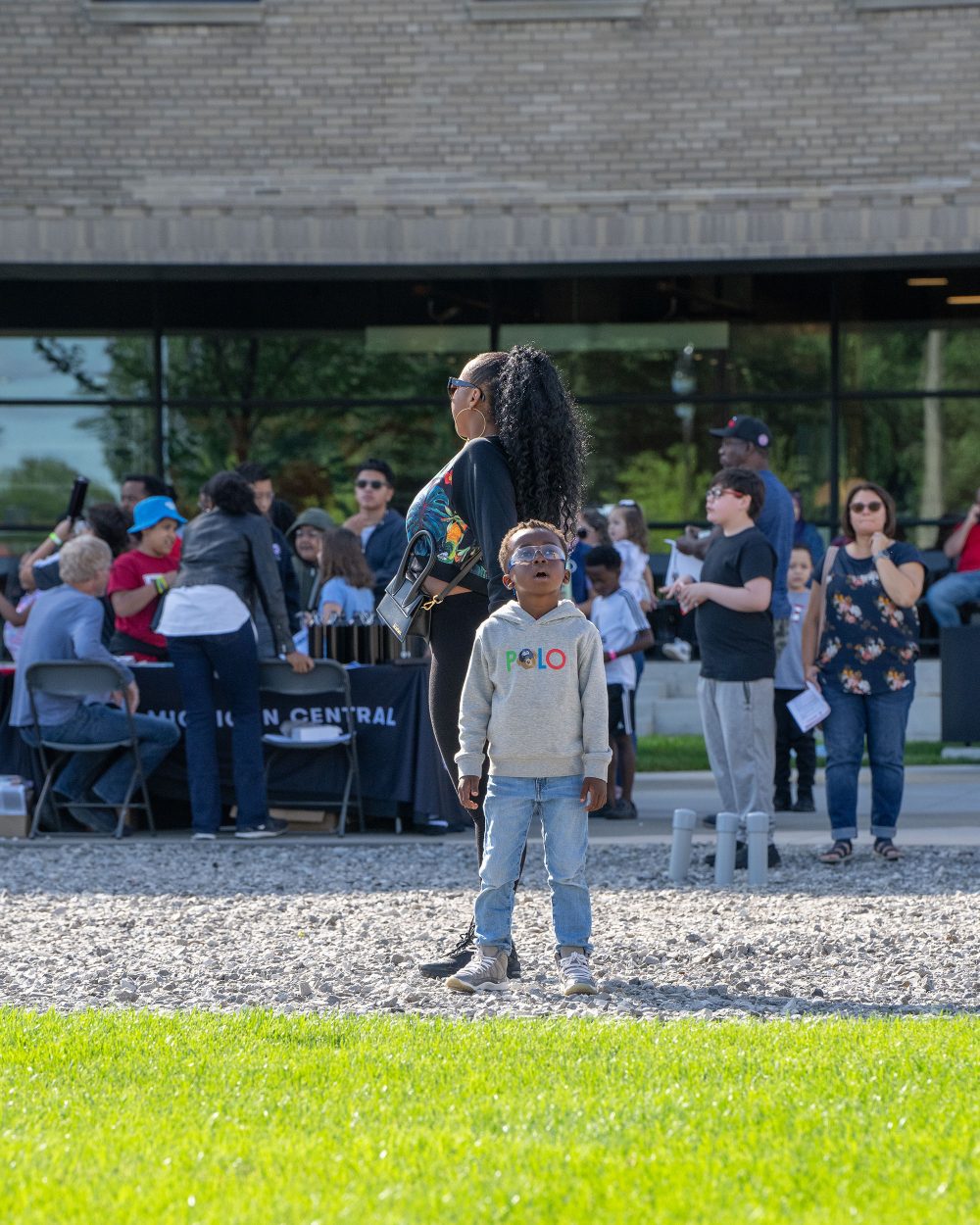 A young child looks up in awe at the Drone demonstrations.